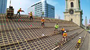 Renaissance restoration specialists working on the roof of a historic buiding